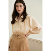 Textured silk blouse with pleated long sleeves and soft sheen finish for elegant styling